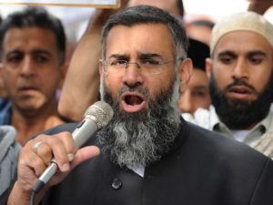 (FILES) In this file picture taken on September 14, 2012 Muslim cleric Anjem Choudary speaks to a group of demonstrators protesting against a film apparently made in the US that they say insults the Islamic faith as they demonstrate outside the US embassy in central London. With the prime minister set to argue that the jihadists pose a direct threat to Britain, nine people were arrested in London early September 25, 2014 on suspicion of encouraging terrorism and belonging to and supporting a banned organisation. They are accused of being members of the extremist Islamist group Al-Muhajiroun, co-founded by one of the detained men, Anjem Choudary, Britain's Press Association reported. AFP PHOTO / LEON NEAL (Photo credit should read LEON NEAL/AFP/Getty Images)