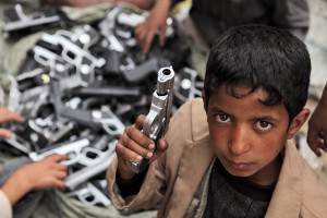 SANAA, YEMEN - MARCH 22, 2012: Children playing with toy guns on