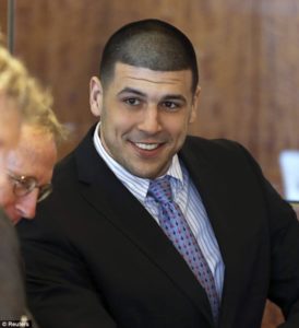 Aaron Hernandez smiling in court